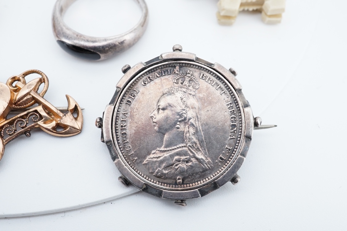 A small group of sterling, white metal and and other jewellery, including a charm bracelet, frog brooch, etc.